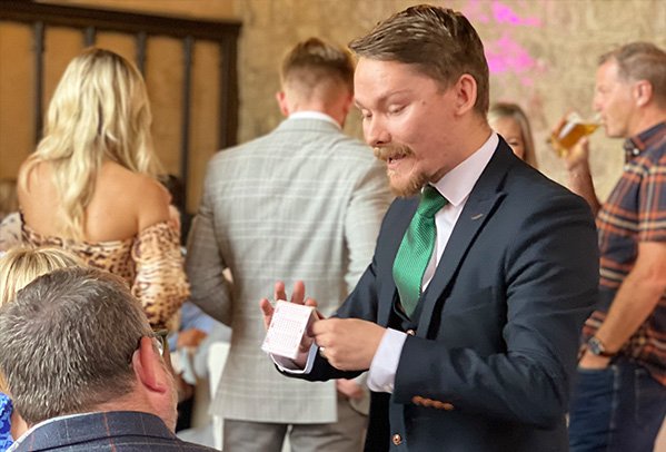 Close Up Magician Ryan Beck performing at a wedding